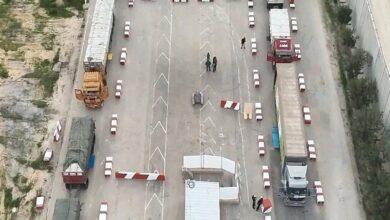 Accumulation of 1,000 trucks carrying aid at Karam Abu Salem crossing