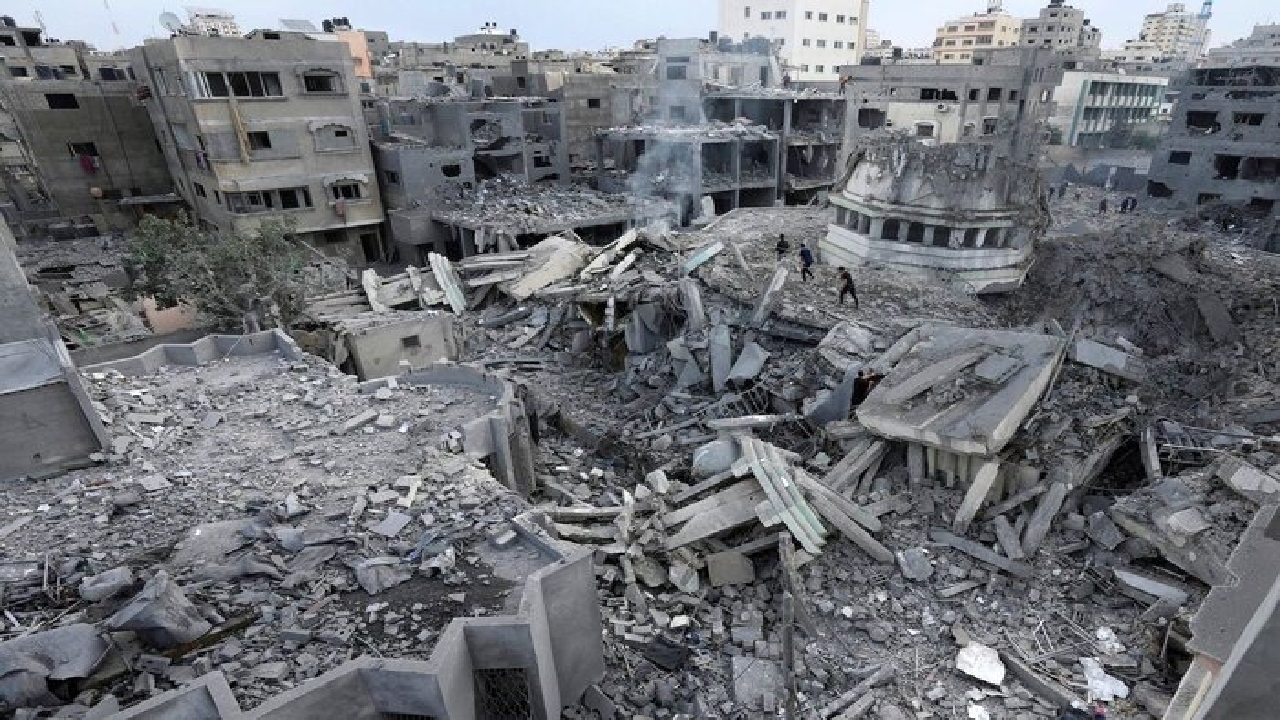 Removing the burnt bodies of 60 martyrs from under the rubble in ...