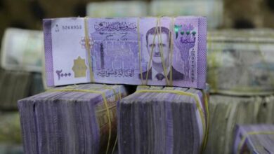 The value of the Syrian currency was halved